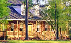 phot of a Summerville SC home with trees in the front yard